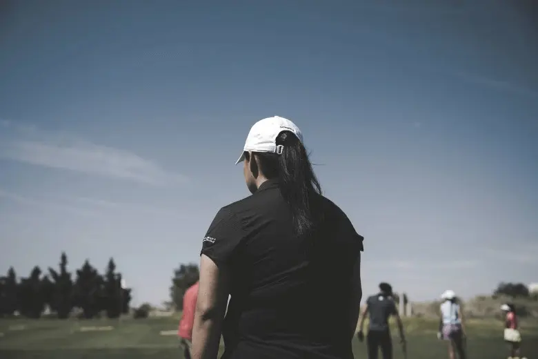A woman golf player practicing the game